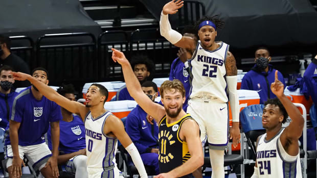 Kings forward Richaun Holmes (22) guard Buddy Hield (24) guard Tyrese Haliburton (0) and Pacers forward Domantas Sabonis (11)